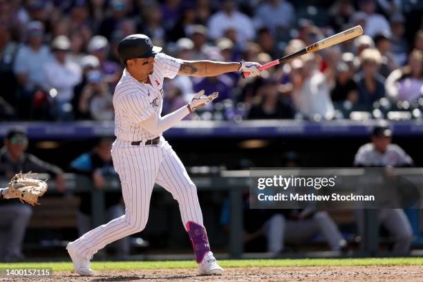 Yonathan Daza of the Colorado Rockies hits a three RBI double against the Miami Marlins in the seventh inning at Coors Field on May 30, 2022 in...