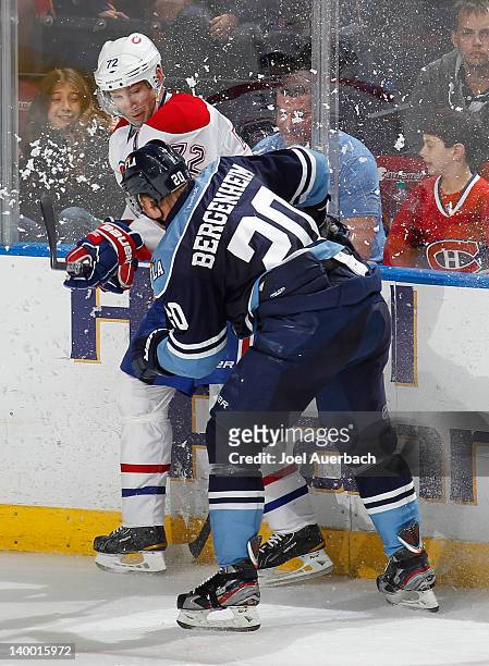 Sean Bergenheim of the Florida Panthers checks Erik Cole of the Montreal Canadiens on February 26, 2012 at the BankAtlantic Center in Sunrise,...