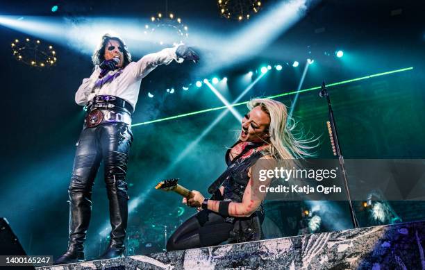 Alice Cooper and Nita Strauss perform on stage at Resorts World Arena on May 30, 2022 in Birmingham, England.