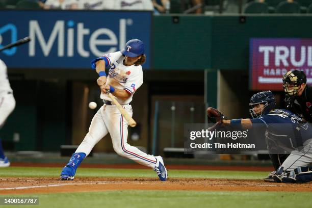 Josh Smith of the Texas Rangers singles for his first Major League hit in the second inning against the Tampa Bay Rays at Globe Life Field on May 30,...