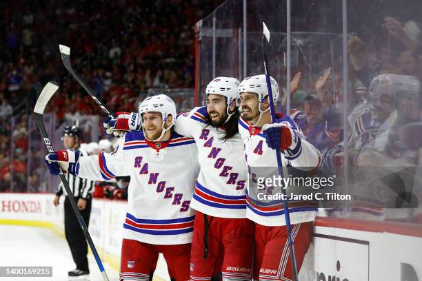 Chris Kreider celebrates with Mika Zibanejad and Adam Fox of the New York Rangers following a first period goal in Game Seven of the Second Round of...