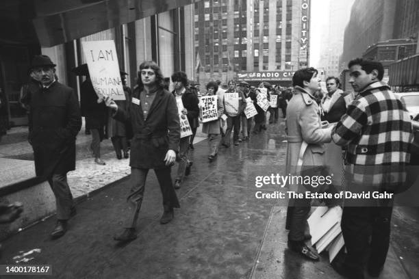 Following the Stonewall riots in the Summer of 1969, the Gay Liberation Front organizes and marches in New York City at the Time, Inc. Headquarters...