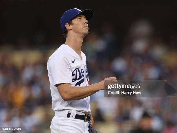 Walker Buehler of the Los Angeles Dodgers reacts after a three run homerun to Tucupita Marcano of the Pittsburgh Pirates, to trail 3-0, during the...