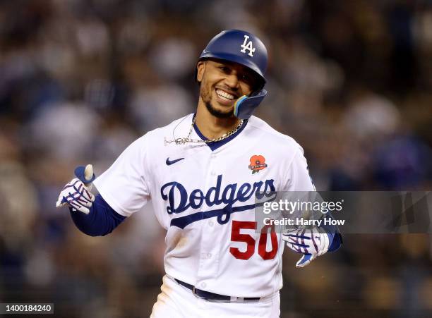 Mookie Betts of the Los Angeles Dodgers celebrates his solo homerun as he runs the bases, to trail 4-2 to the Pittsburgh Pirates, during the fifth...