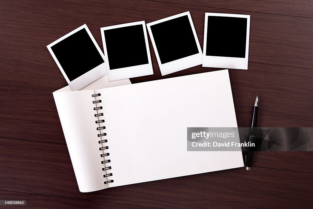 Spiral notebook with blank photo prints
