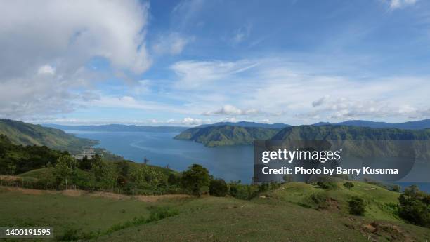 tuk tuk samosir island, toba lake. - lake toba sumatra stock pictures, royalty-free photos & images