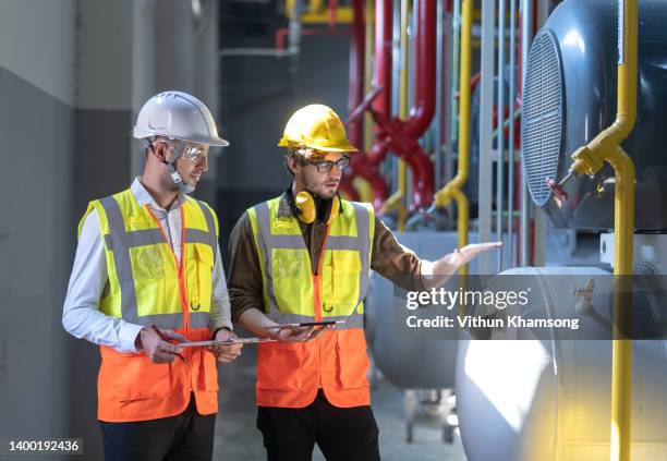 two engineer working at industrial and pipeline factory. - boiler engineer stockfoto's en -beelden