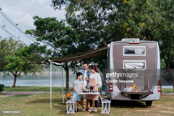 asian family caravan picnic vacation at public park - släp kläder bildbanksfoton och bilder