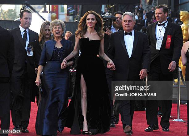 Actress Angelina Jolie arrives with Brad Pitt's parents Jane and William Pitt on the red carpet for the 84th Annual Academy Awards on February 26,...