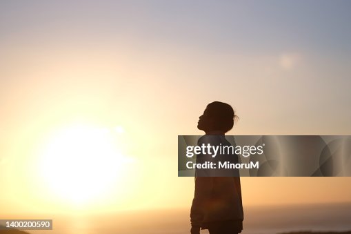 Silhouette of boy in morning glow Silhouette of boy in morning glow