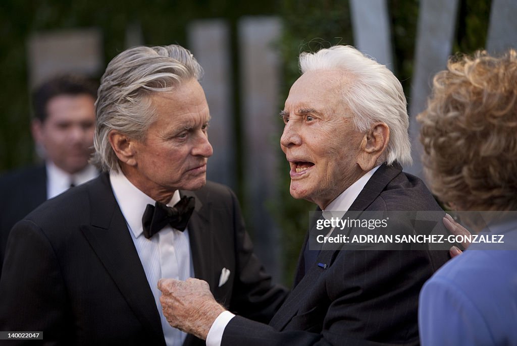 Michael Douglas (L) greets his parents K