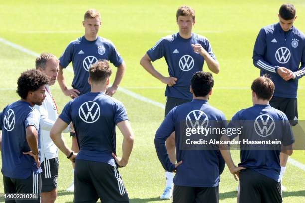 Hans-Dieter Flick, head coach of the German national team talks to his players during a training session of the German national soccer team during a...