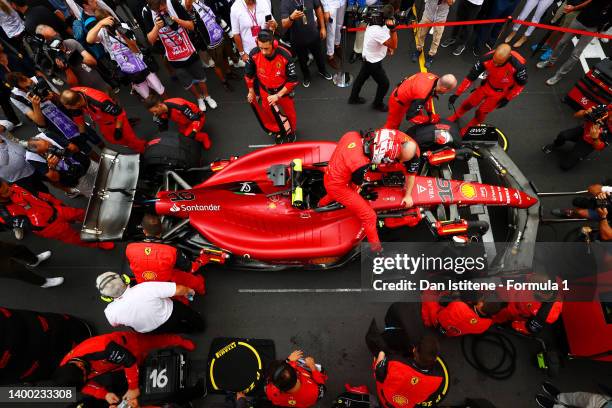 Charles Leclerc of Monaco and Ferrari climbs out of his Ferrari F1-75 on the grid as he prepares ahead of the F1 Grand Prix of Monaco at Circuit de...