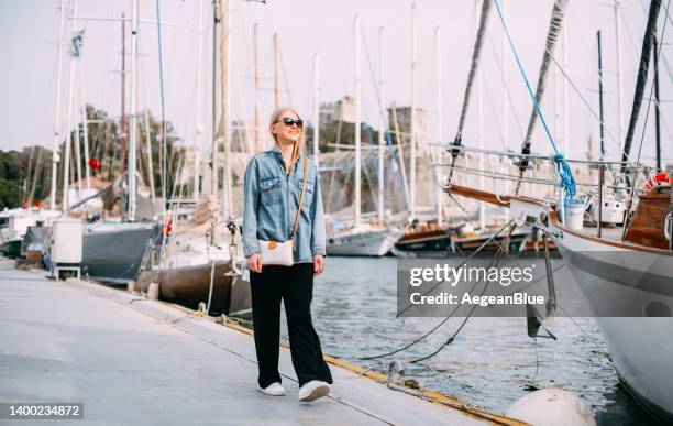 woman enjoying weekend break - marina stock pictures, royalty-free photos & images