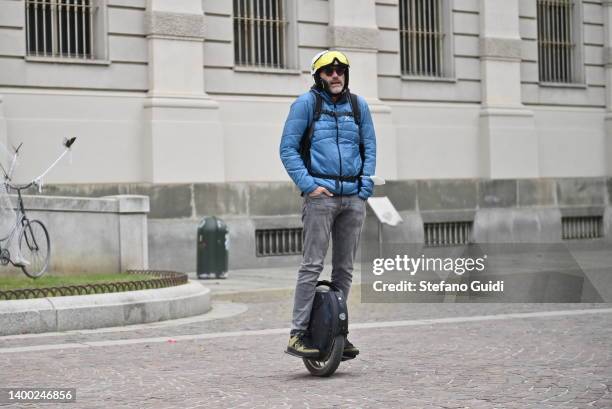 Man rides on an electric single-wheel Segway in Piazza Carignano on May 31, 2022 in Turin, Italy.