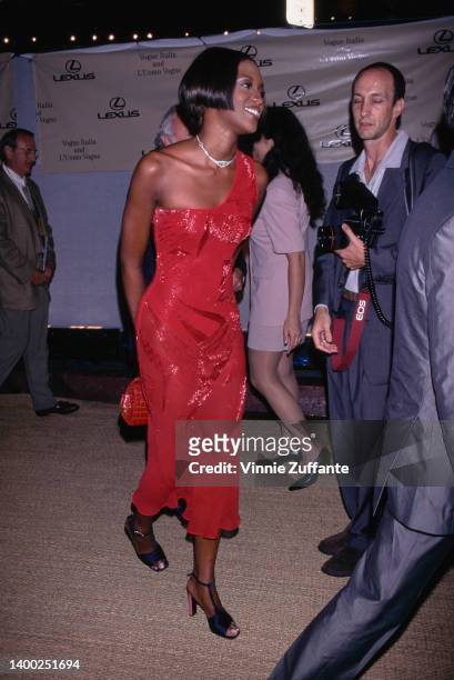 British fashion model Naomi Campbell, wearing a red one-shoulder dress, attends the inaugural 'A Tribute To Style' event, held on Rodeo Drive in Los...