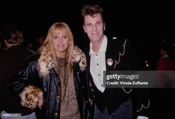 Swedish actress and singer Britt Ekland and her husband, American drummer Slim Jim Phantom attend an event, United States, circa 1987.