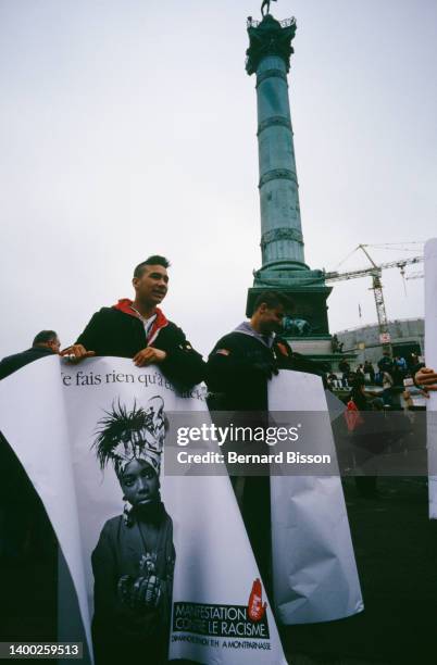 High school students, holding banners, demonstrate in the Parisian street Rue Monsieur le Prince to commemorate the first anniversary of Malik...