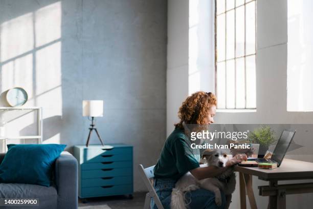 adult female student studying online using a laptop - school life balance stock pictures, royalty-free photos & images