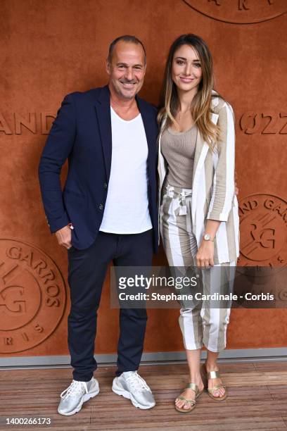 Roger Erhart and Delphine Wespiser attend the French Open 2022 at Roland Garros on May 31, 2022 in Paris, France.