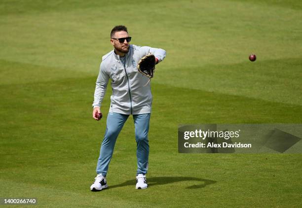 England Men's Test Coach, Brendon McCullum takes part in a fielding drill during a England Training Session at Lord's Cricket Ground on May 31, 2022...