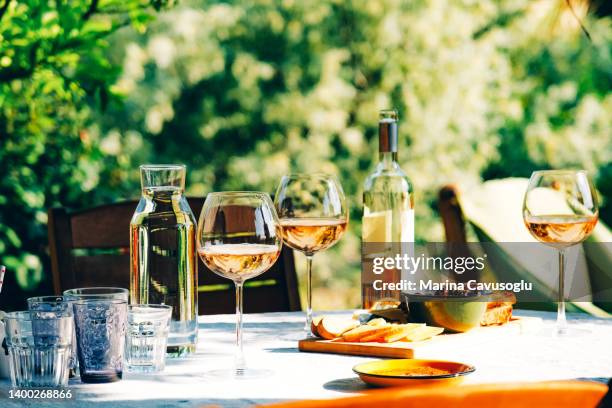 wine glasses and appetisers on the table - wine ストックフォトと画像