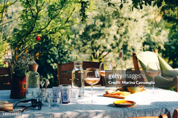 wine glasses and appetisers on the table - al fresco dining stock pictures, royalty-free photos & images