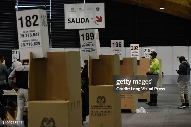 People vote at the Corferias mass ballot place in Bogota, Colombia during the 2022 Presidential elections on May 29, 2022.