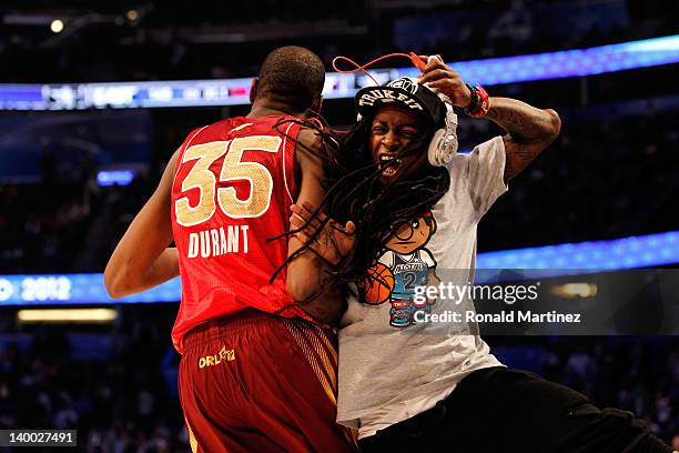 All-Star MVP Kevin Durant of the Oklahoma City Thunder and the Western Conference celebrates with hip-hop artist Lil' Wayne during the 2012 NBA...