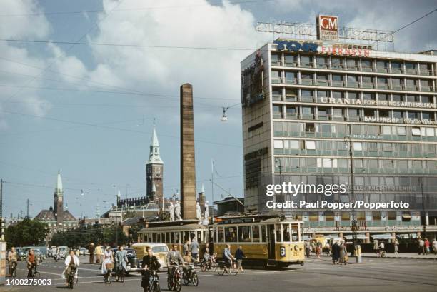 Pedestrians, cyclists, cars and trams on Vesterbrogade, a shopping street in the Vesterbro district of Copenhagen, capital city of Denmark on the...