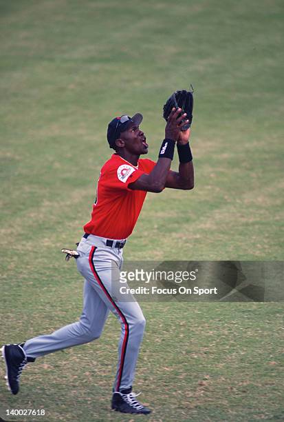 Michael Jordan of the Birmingham Barons the Double A minor league affiliate of the Chicago White Sox catches a fly ball during a minor league...