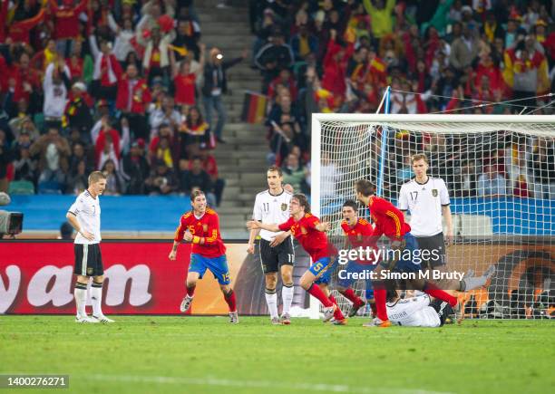 Carles Puyol of Spain celebrates with David Villa ,Sergio Ramos and Gerard Pique after scoring the winning goal during the World Cup Semi Final match...