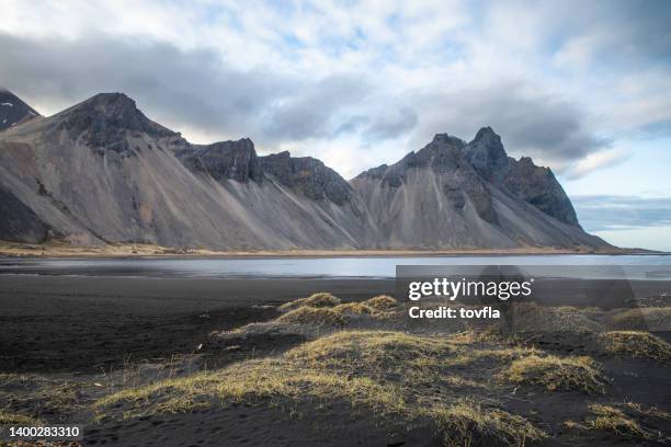 stokksnes iceland vestrahorn black sand beach - black sand iceland stock pictures, royalty-free photos & images