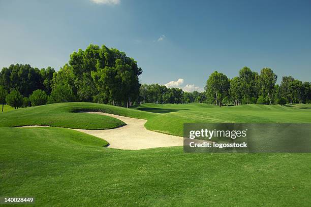 beautiful golf course with sand trap - golf green stock pictures, royalty-free photos & images