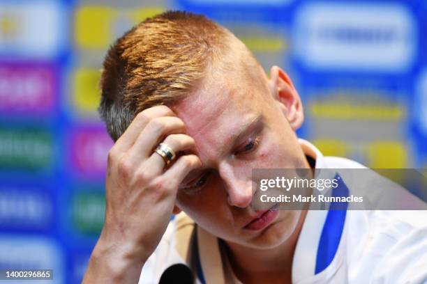 Oleksandr Zinchenko of Ukraine reacts emotionally as they speak to the media during the Ukraine Press Conference at Hampden Park on May 31, 2022 in...