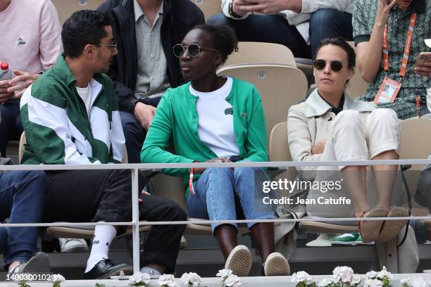 Djanis Bouzyani, Eye Haïdara and Bérénice Bejo attend the French Open 2022 at Roland Garros on May 30, 2022 in Paris, France.