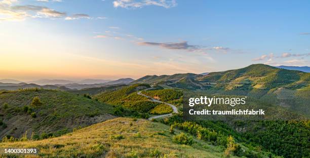 sunset road - albania fotografías e imágenes de stock