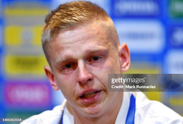 Oleksandr Zinchenko of Ukraine reacts emotionally as they speak to the media during the Ukraine Press Conference at Hampden Park on May 31, 2022 in...