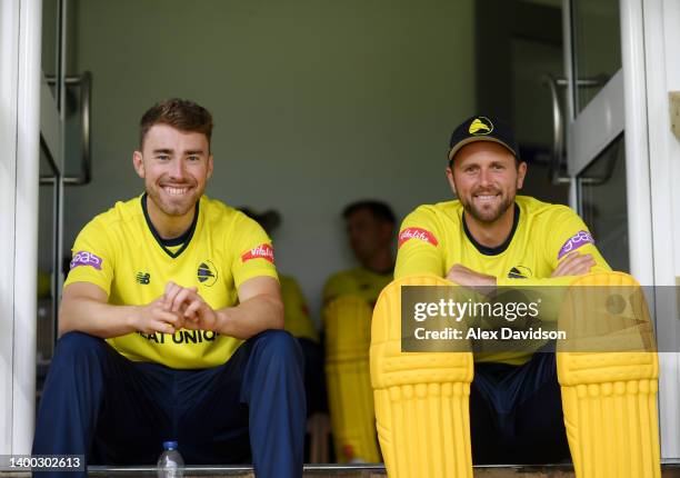 Joe Weatherley and Ross Whiteley of Hampshire wait in the changing rooms for the rain to subside during the Vitality T20 Blast match between Essex...