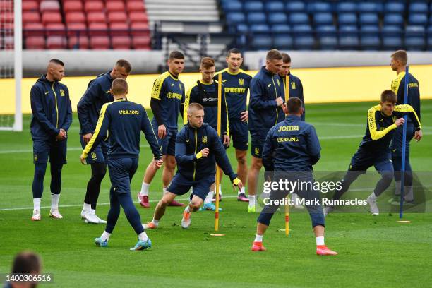 Oleksandr Zinchenko of Ukraine warms up during the Ukraine Training Session at Hampden Park on May 31, 2022 in Glasgow, Scotland.