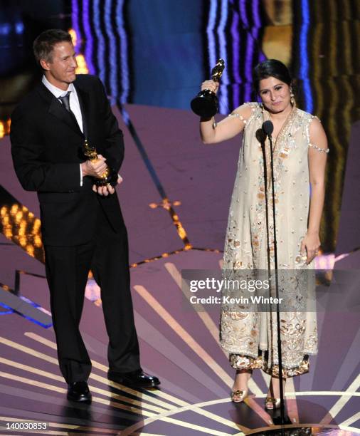 Filmmakers Daniel Junge and Sarmeen Obaid-Chinoy accept the Documentary Short Subject Award for 'Saving Face' onstage during the 84th Annual Academy...