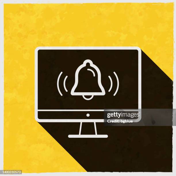 stockillustraties, clipart, cartoons en iconen met desktop computer with ringing bell - notification. icon with long shadow on textured yellow background - handbel