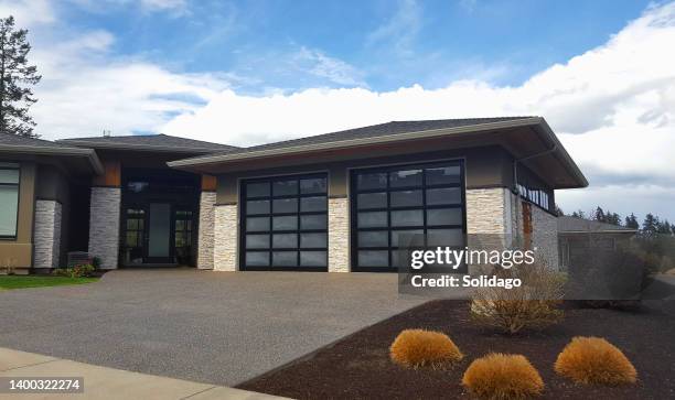 modern two car garage with style and pizzazz - new pavement stock pictures, royalty-free photos & images