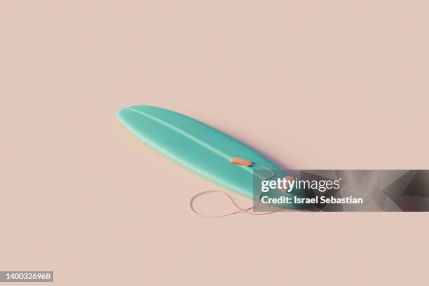 digitally generated image of a blue surfboard on a pink background. water sports background. - surfbrett stock-fotos und bilder