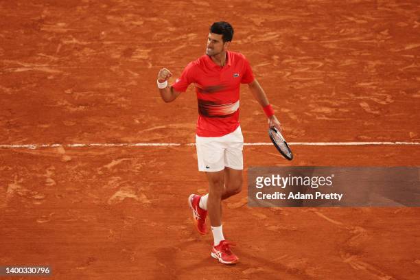 Novak Djokovic of Serbia celebrates against Rafael Nadal of Spain during the Men's Singles Quarter Final match on Day 10 of The 2022 French Open at...