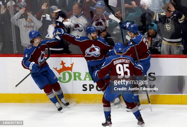 Compher of the Colorado Avalanche celebrates with his teammates after scoring a goal on Mike Smith of the Edmonton Oilers during the first period in...