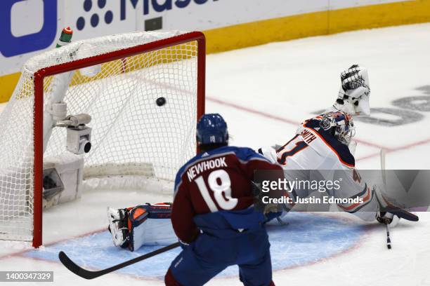 Mike Smith of the Edmonton Oilers gives up a goal to J.T. Compher of the Colorado Avalanche during the first period in Game One of the Western...