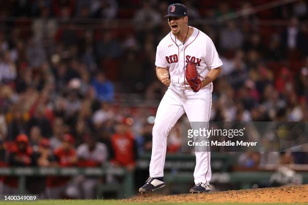 Tyler Danish of the Boston Red Sox celebrates after striking out Tyler Stephenson of the Cincinnati Reds during the eighth inning at Fenway Park on...