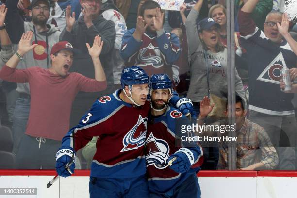Andrew Cogliano of the Colorado Avalanche celebrates with Jack Johnson after scoring a goal against the Edmonton Oilers during the second period in...