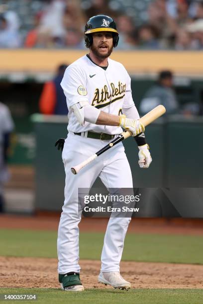 Jed Lowrie of the Oakland Athletics reacts after he flied out with the bases loaded to end the fourth inning against the Houston Astros at...